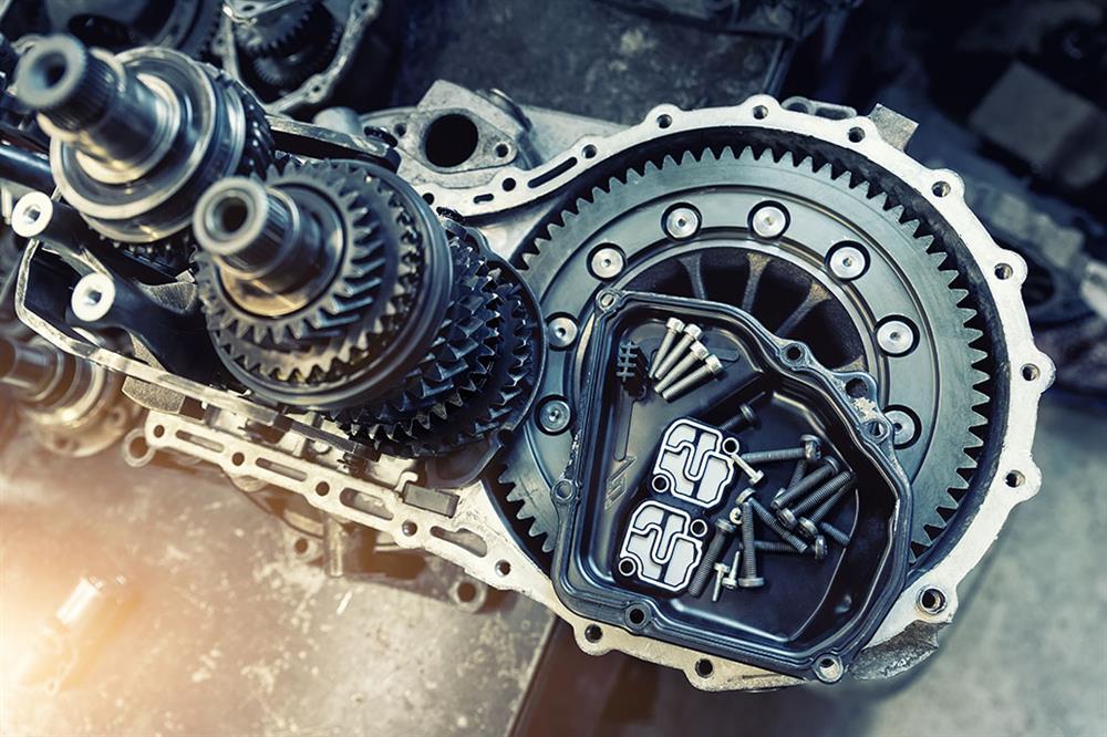 A high performance transmission with a tray of screws on top.