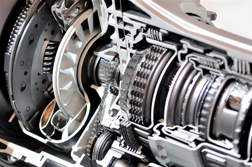 A brand new car transmission with polished chains.