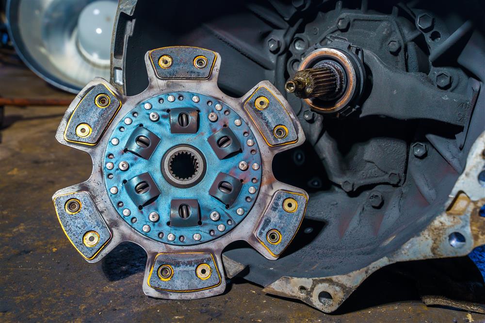 A worn out piece of car machinery removed from its housing.